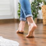 young woman walking in the house on the warm floor