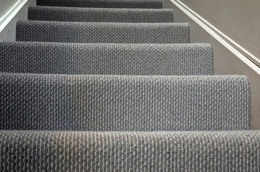 Older, discolored carpet on stairs