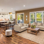 Hardwood flooring spanning from kitchen to living room in open concept home