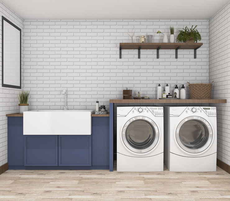 A photo showing a large sink, washer, and dryer on hardwood flooring.